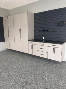 A professional showcase of Garage Storage Services, featuring tall tan textured cabinets