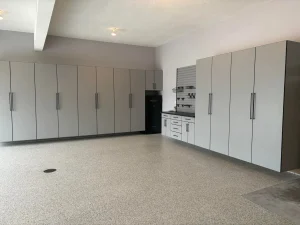 An expansive, high-end showroom-style garage featuring Designer Line Garage Ideas